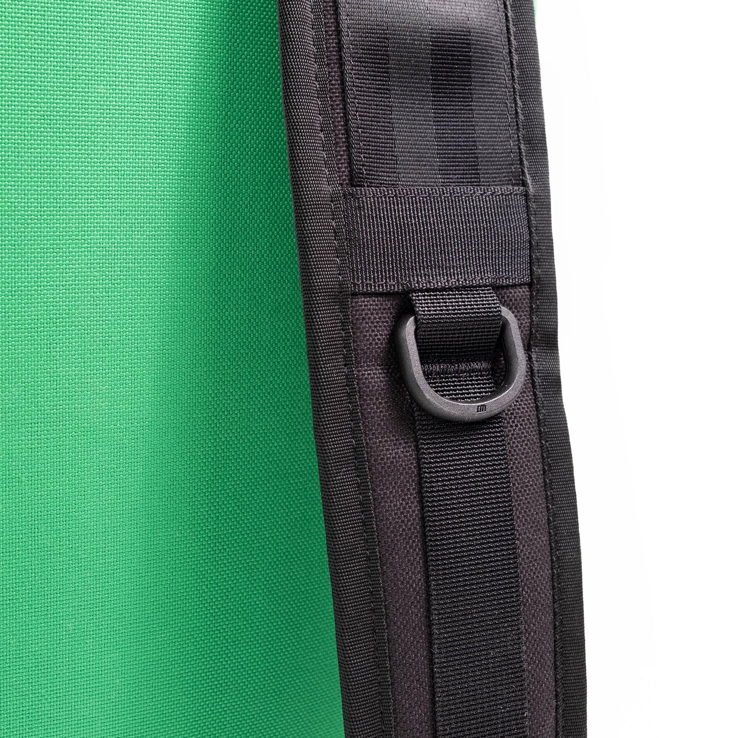 General detail image of  strap hooks on the straps on the back of the Topo Designs Klettersack Classic vintage-inspired rucksack backpack in "Alpine Meadow".
