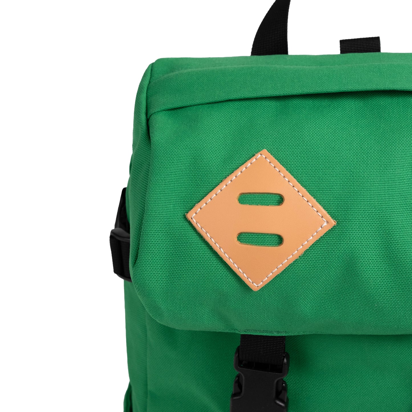 General  closeup detail image of leather lash tabs on the front of the Topo Designs Klettersack Classic vintage-inspired rucksack backpack in "Alpine Meadow".