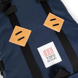 General detail image of leather lash tabs on the front of the Topo Designs Klettersack Classic vintage-inspired rucksack backpack in "Midnight".