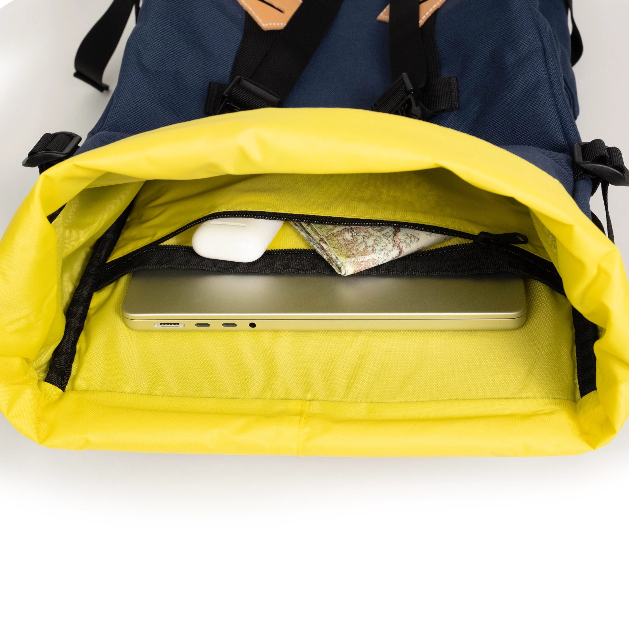 General detail interior image of internal laptop sleeve and zippered pocket inside the Topo Designs Klettersack Classic vintage-inspired rucksack backpack in "Midnight".