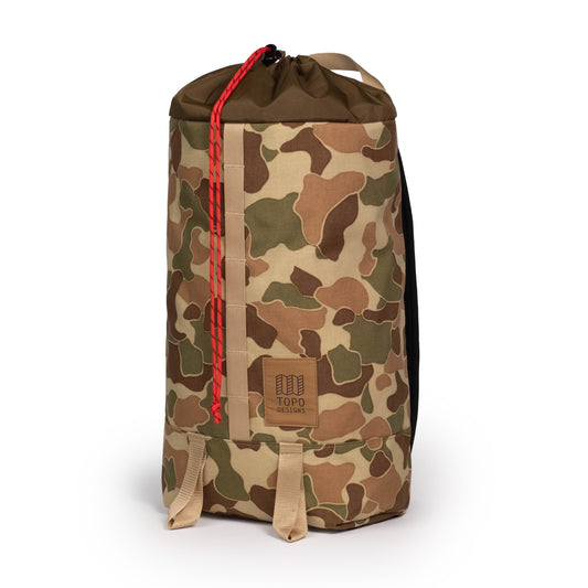 Quarter View of Topo Designs Cosmos Backpack in "Duck Camo"