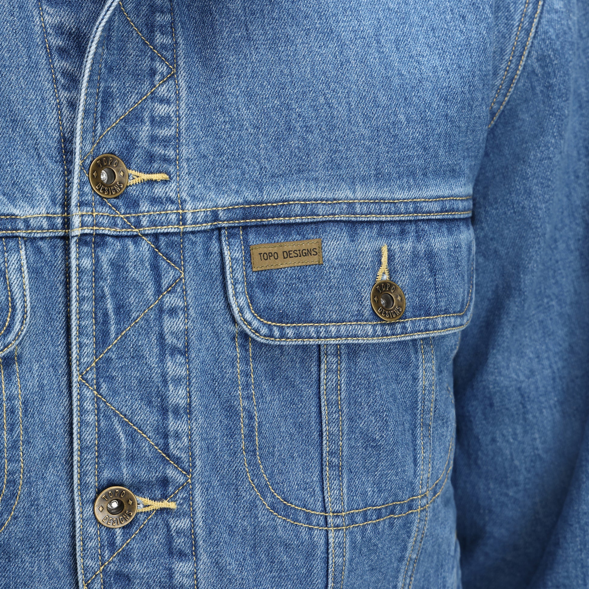 General Detail shot of Topo Designs Sightseer Jean Jacket - Men's in "Mid Denim"
