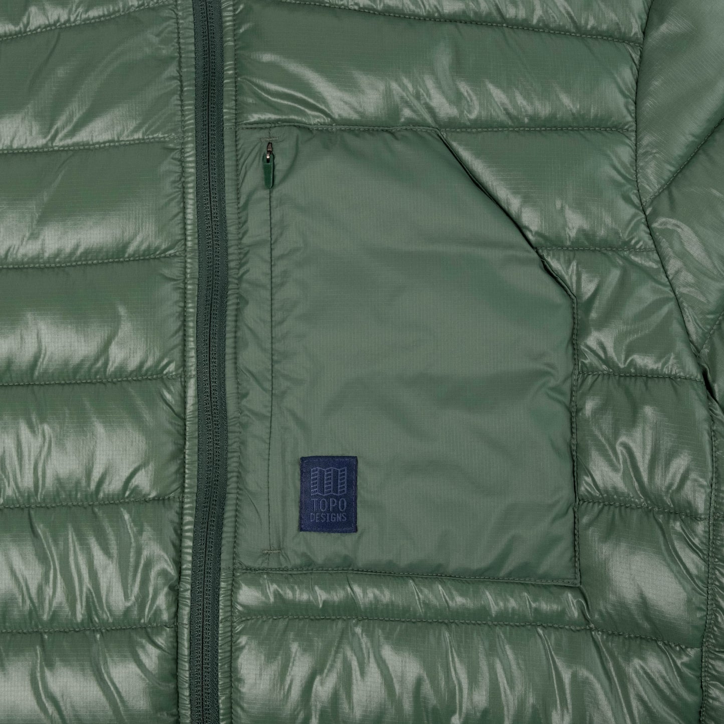 General Detail shot of Topo Designs Townie Puffer Jacket - Men's in "Forest"