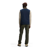 General back model shot of Topo Designs Vista Lightweight Fleece Vest - Men's in "Midnight / Desert Palm"