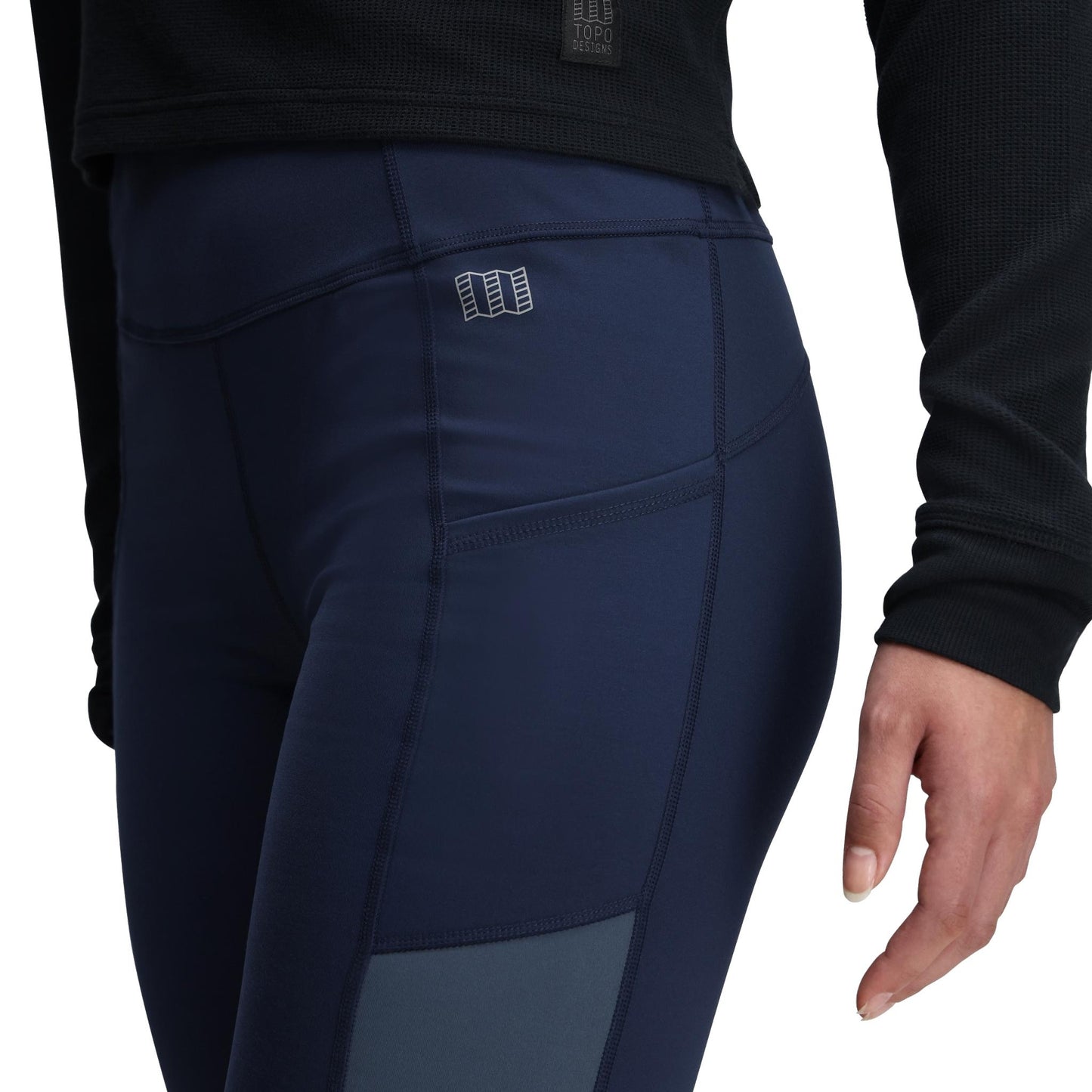 General Detail shot of Topo Designs StayWarm Trail Legging - Women's in "Midnight / Stone Blue"