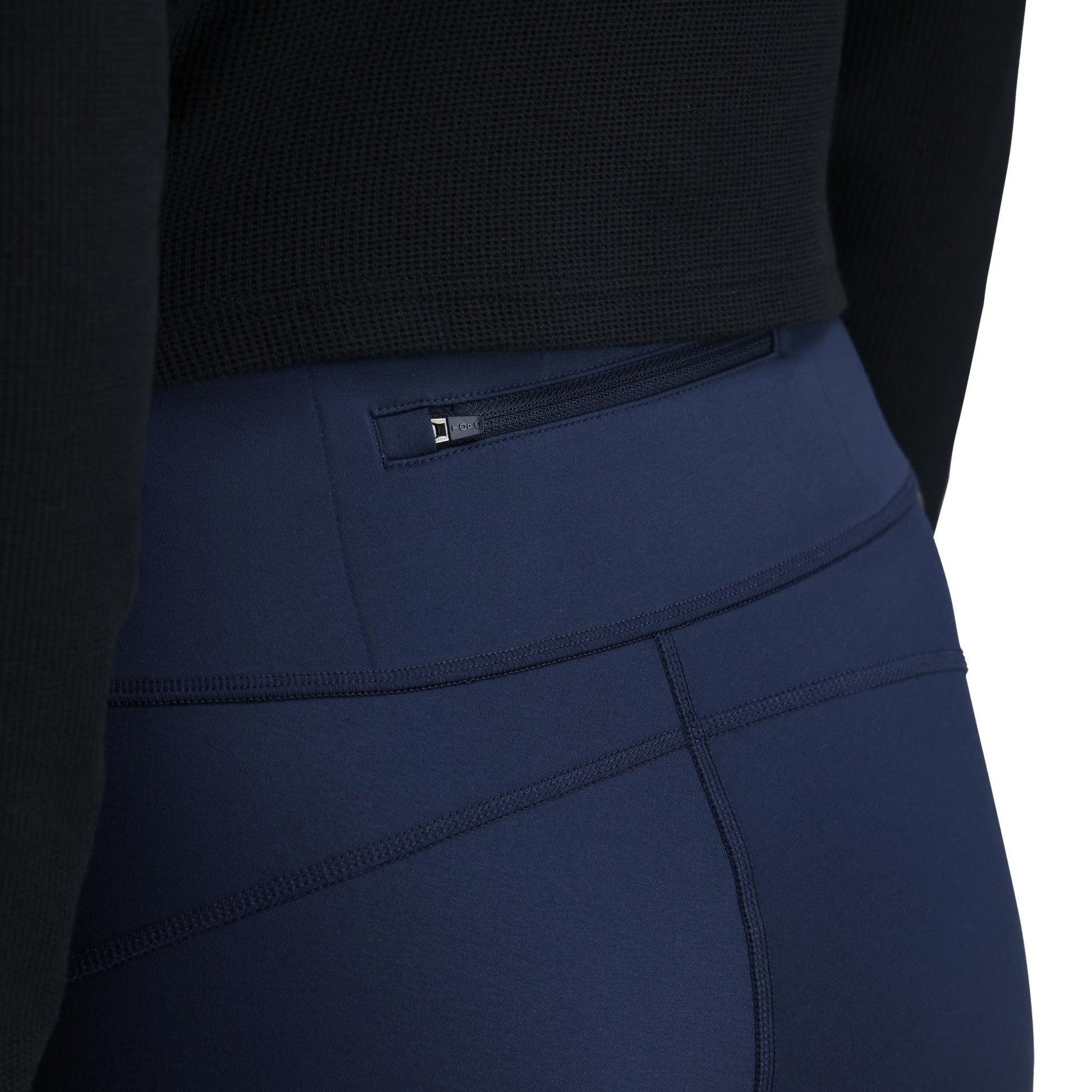 General Detail shot of Topo Designs StayWarm Trail Legging - Women's in "Midnight / Stone Blue"