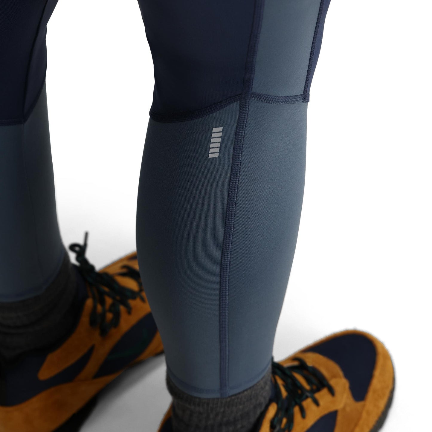 General Detail shot of Topo Designs StayWarm Trail Legging - Women's in "Midnight / Stone Blue"