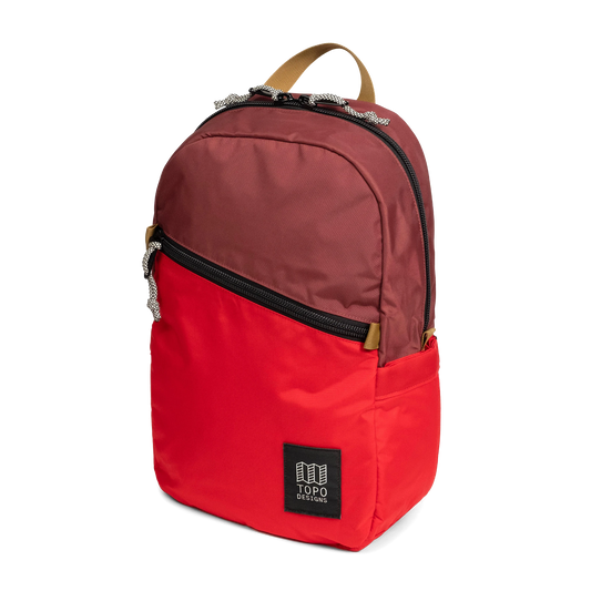 Front view of Topo Designs Light Pack in "Maroon / Salsa"