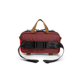 Back view of Topo Designs Mini Quick Pack in "Maroon / Salsa"