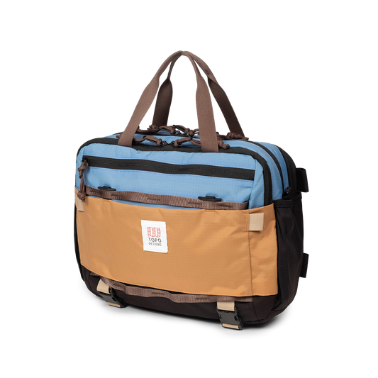 Quarter View of Topo Designs Mountain Cross Bag in "River Blue / Brown Oak"