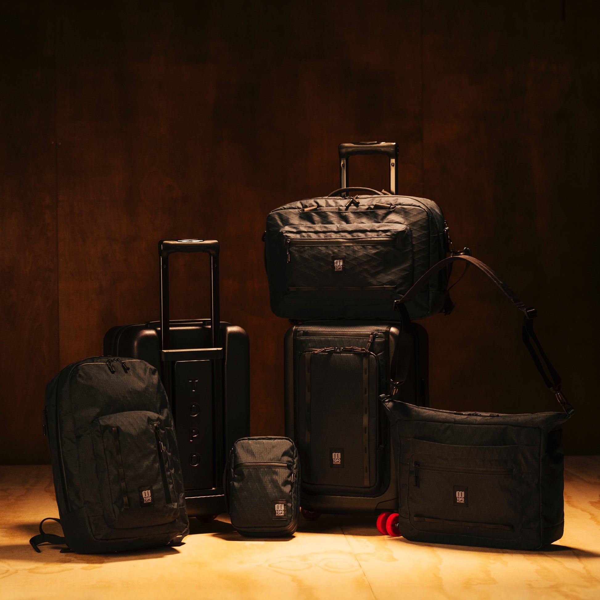 General shot of Topo Designs Tech Case in studio setting with full Global Pro system of products