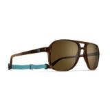 General alternate angled view of VALLON X Topo Designs sunglasses in "Brown / Brown" with sunglass arms open with strap attached.