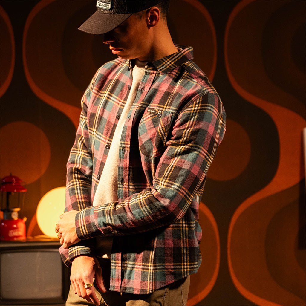 Person wearing a "Black / Goldenrod Multi" Mountain Shirt Lightweight with a dark background