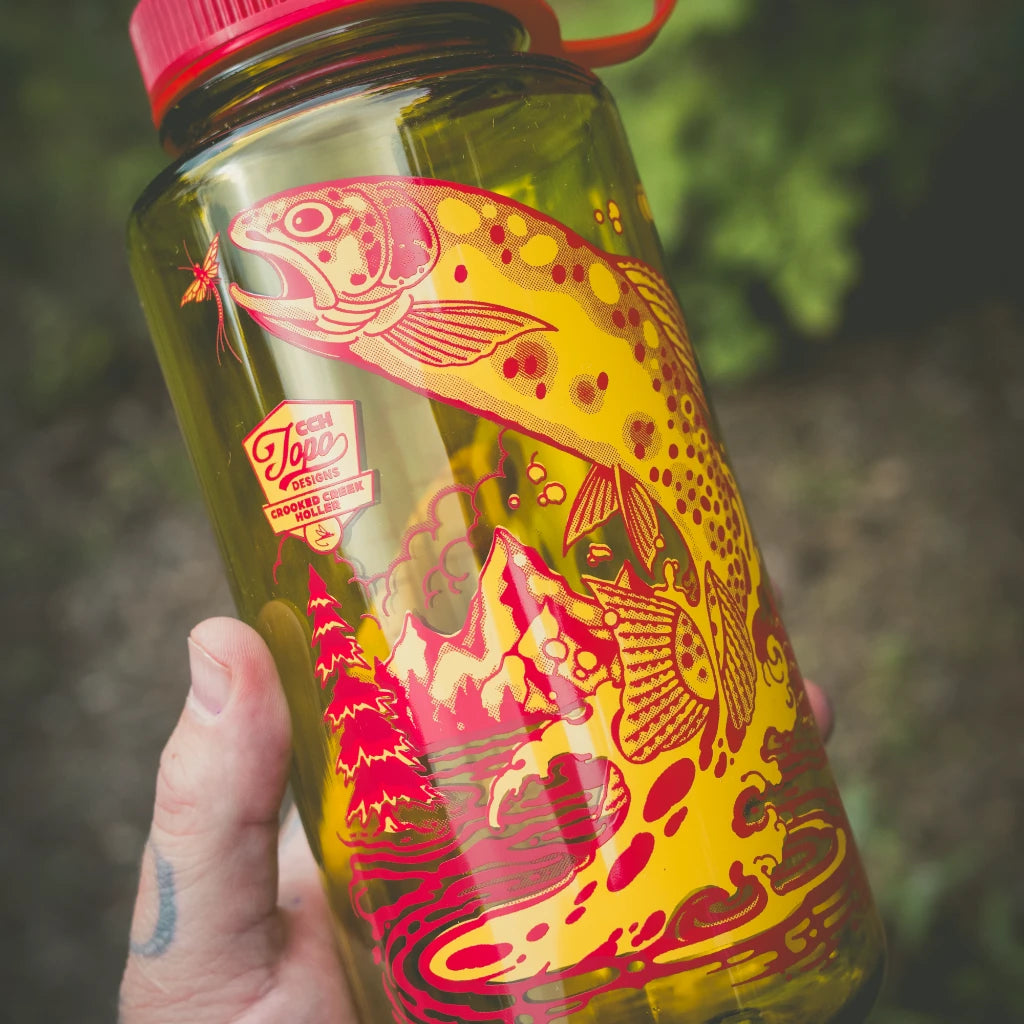 Outdoor detail shot of Topo Designs x CCH x Pine Printshop Nalgene Water Bottle in "Endive"
