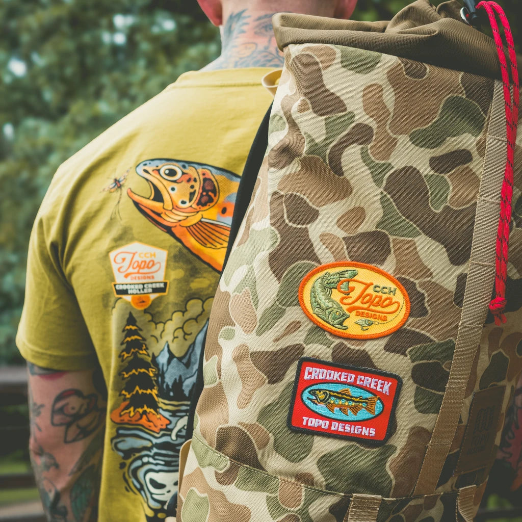 Outdoor detail shot of Topo Designs x CCH x Pine Printshop Patch 2-pack in "Multi"