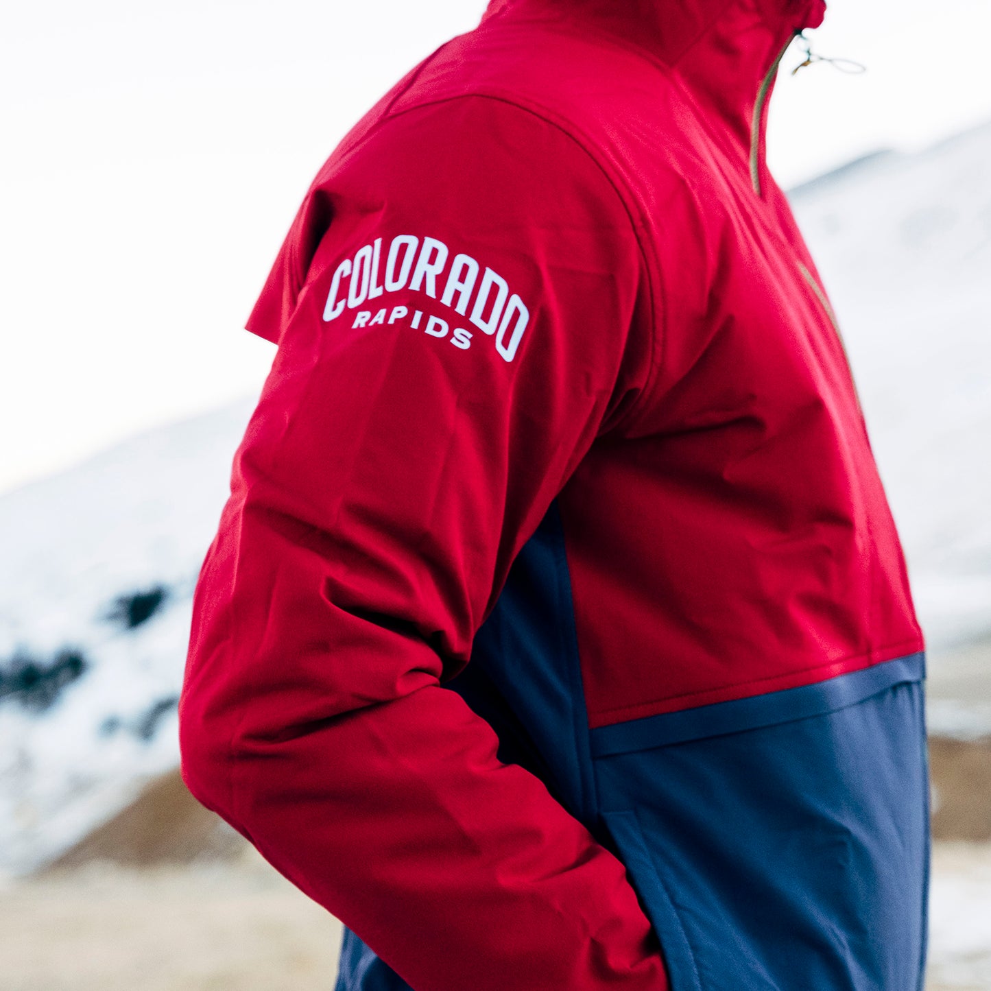General lifestyle shot of Topo Designs x Colorado Rapids HighPeak Jacket