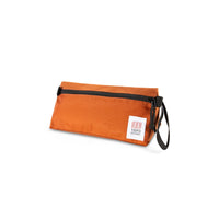 Topo Designs Dopp Kit toiletry travel bag in "Clay - Recycled" orange.
