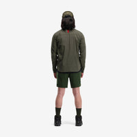 Back model shot of Topo Designs Men's Global lightweight quick dry travel Shorts in "Olive" green.