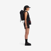 Side model shot of Topo Designs Women's Global lightweight quick dry travel Shorts in "Black"