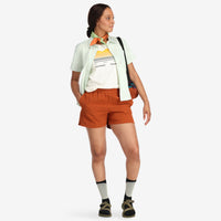 Front model shot of Topo Designs Women's Global lightweight quick dry travel Shorts in "Brick" orange. Show on "slate" "pond blue" & "olive"