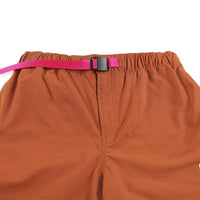 General Web belt on Topo Designs Women's River quick-dry swim Shorts in Brick orange.