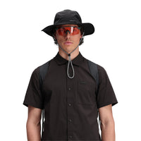 Close up, on model, front shot of Topo Designs Men's Global Shirt Short Sleeve 30+ UPF rated travel shirt in "Black".