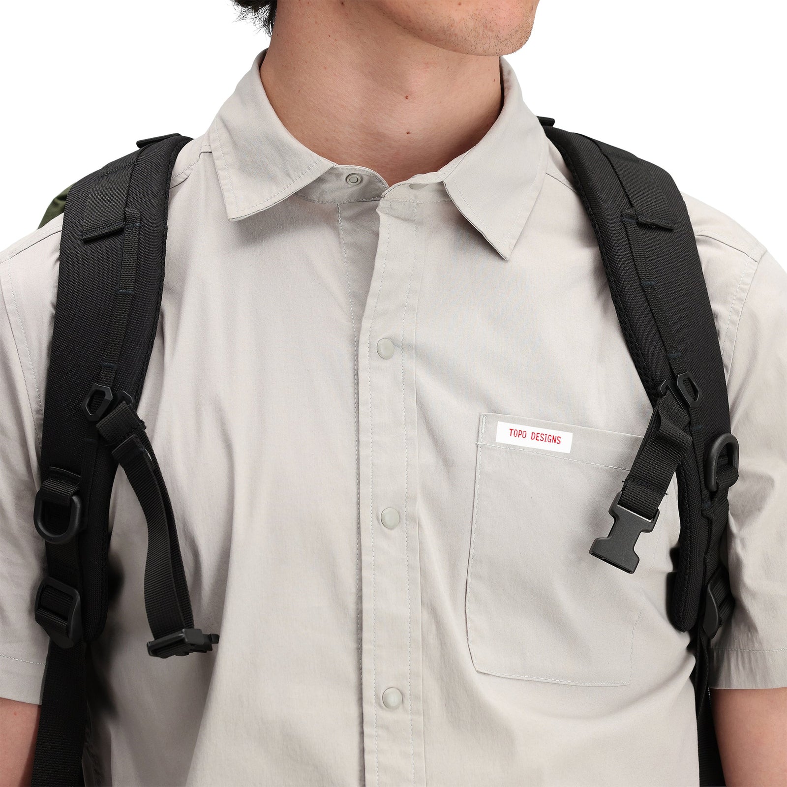 Close up model shot of Topo Designs Men's Global Shirt Short Sleeve 30+ UPF rated travel shirt in "Light Gray".