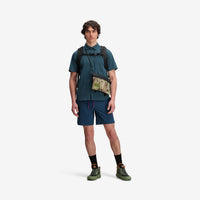 Model shot of Topo Designs X Tenkara Rod Co Kit Accessory Shoulder Bag in "Sierra".