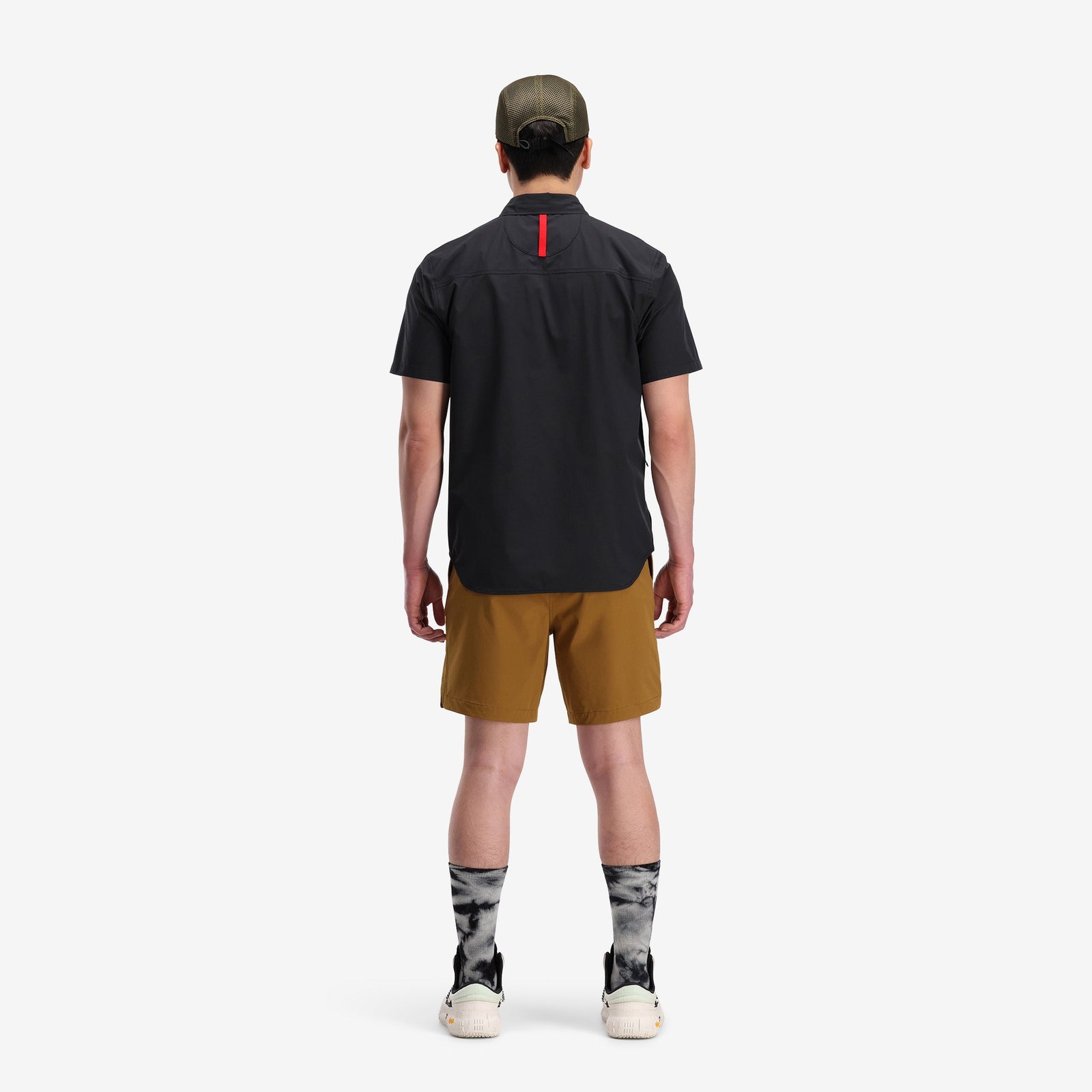 Back model shot of Topo Designs Men's Global lightweight quick dry travel Shorts in "Dark Khaki" green.
