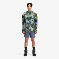General on model front shot of Topo Designs Men's River Hoodie 30+ UPF moisture wicking quick dry top in "Green Camo" green.