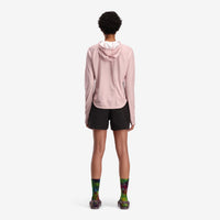 General on model back shot of Topo Designs Women's River Hoodie 30+ UPF rated moisture wicking water shirt in "Haze" red.
