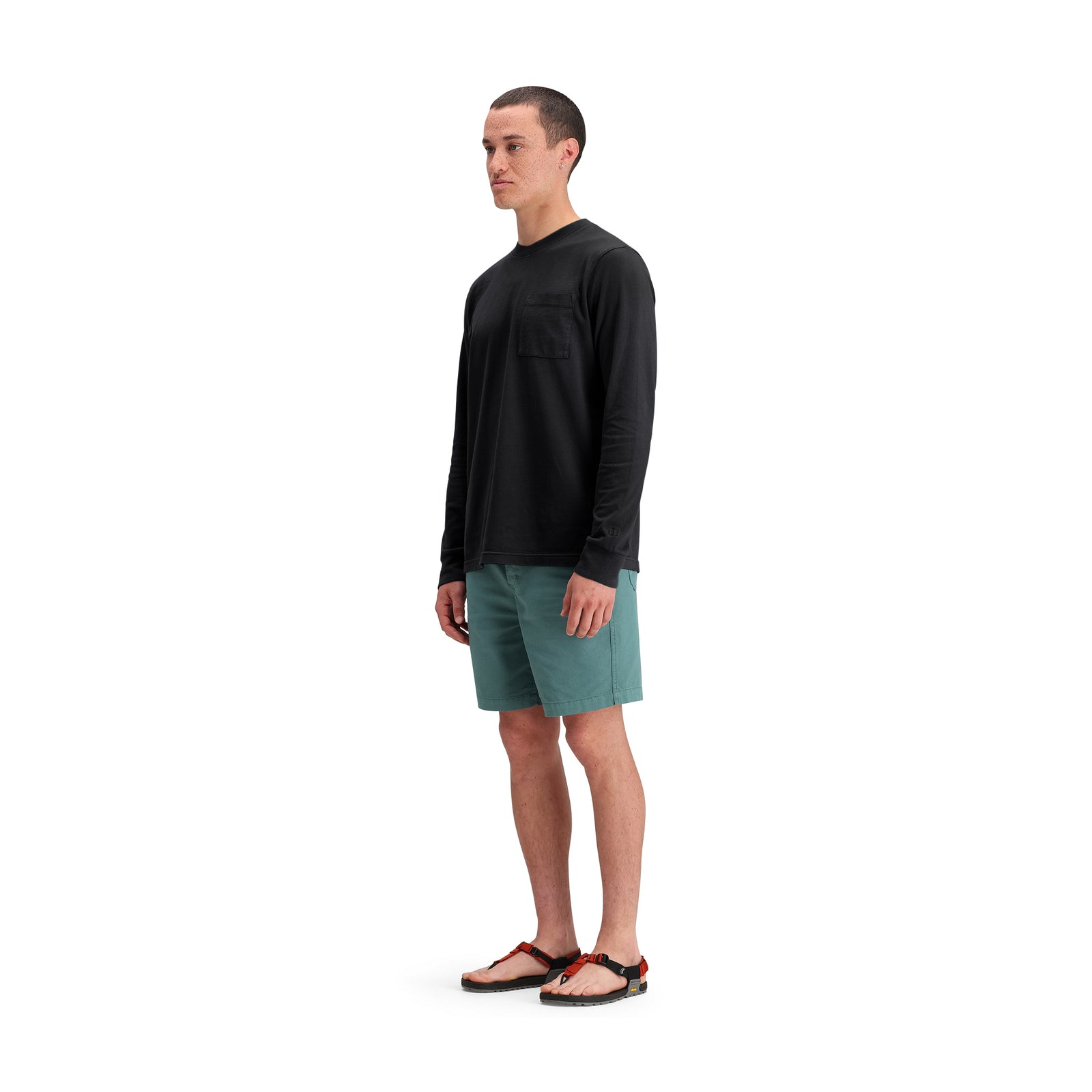 General side model shot of Topo Designs Dirt Shorts - Men's in "Sea Pine"