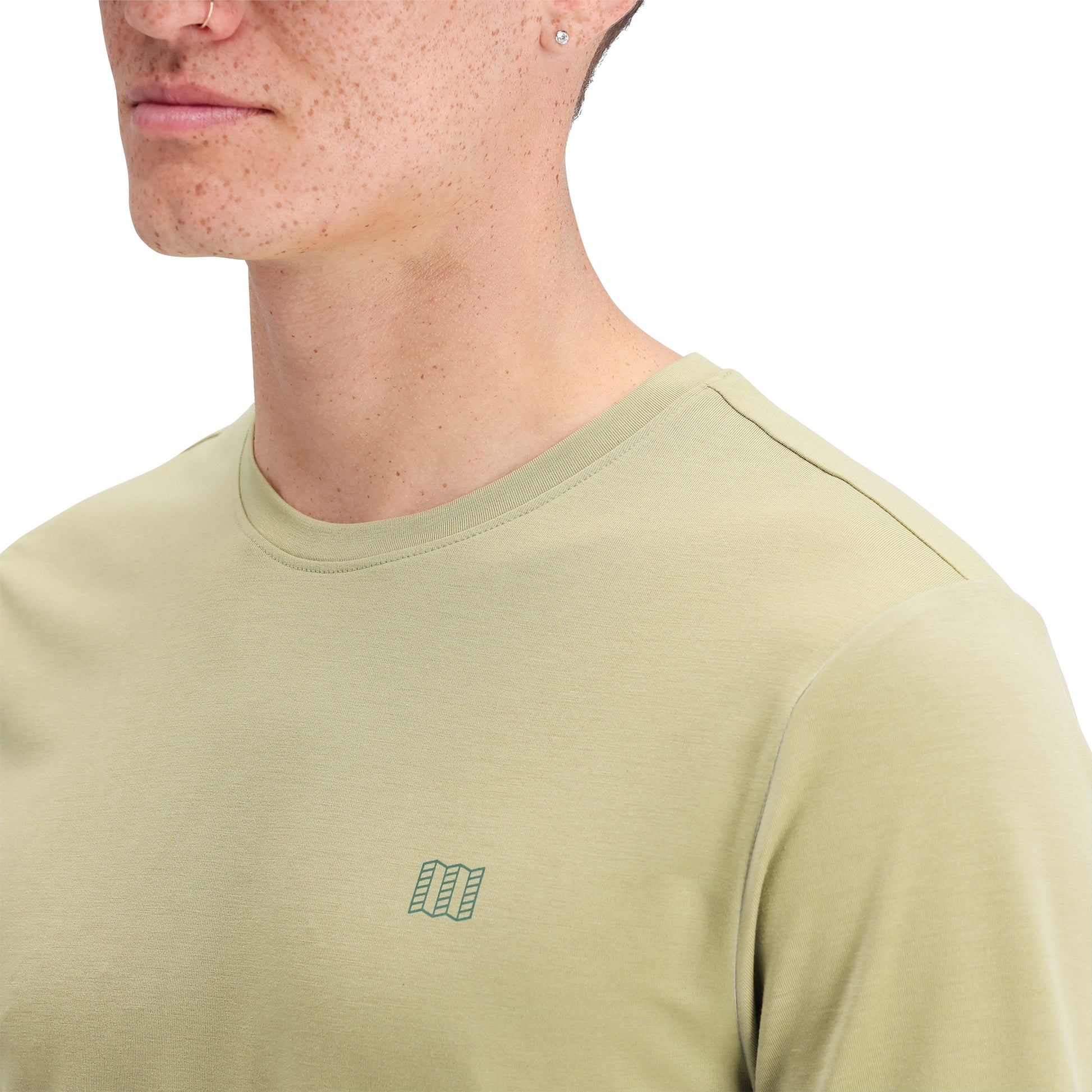 Detail shot of Topo Designs Global Tek Crew Ss - Men's in "Moss"