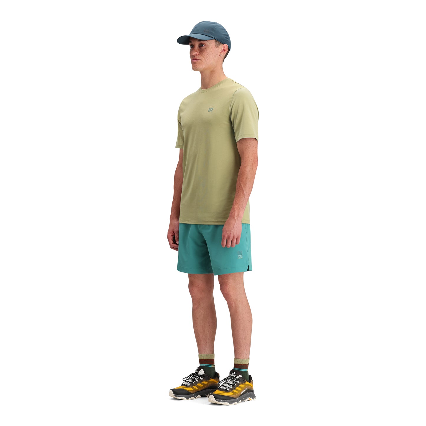 General side model shot of Topo Designs Global Tek Crew Ss - Men's in "Moss"