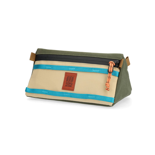 Rectangular bike bag with olive green top, tan body, blue webbing straps, brown leather handles, and orange zipper pull in "Olive / Hemp"