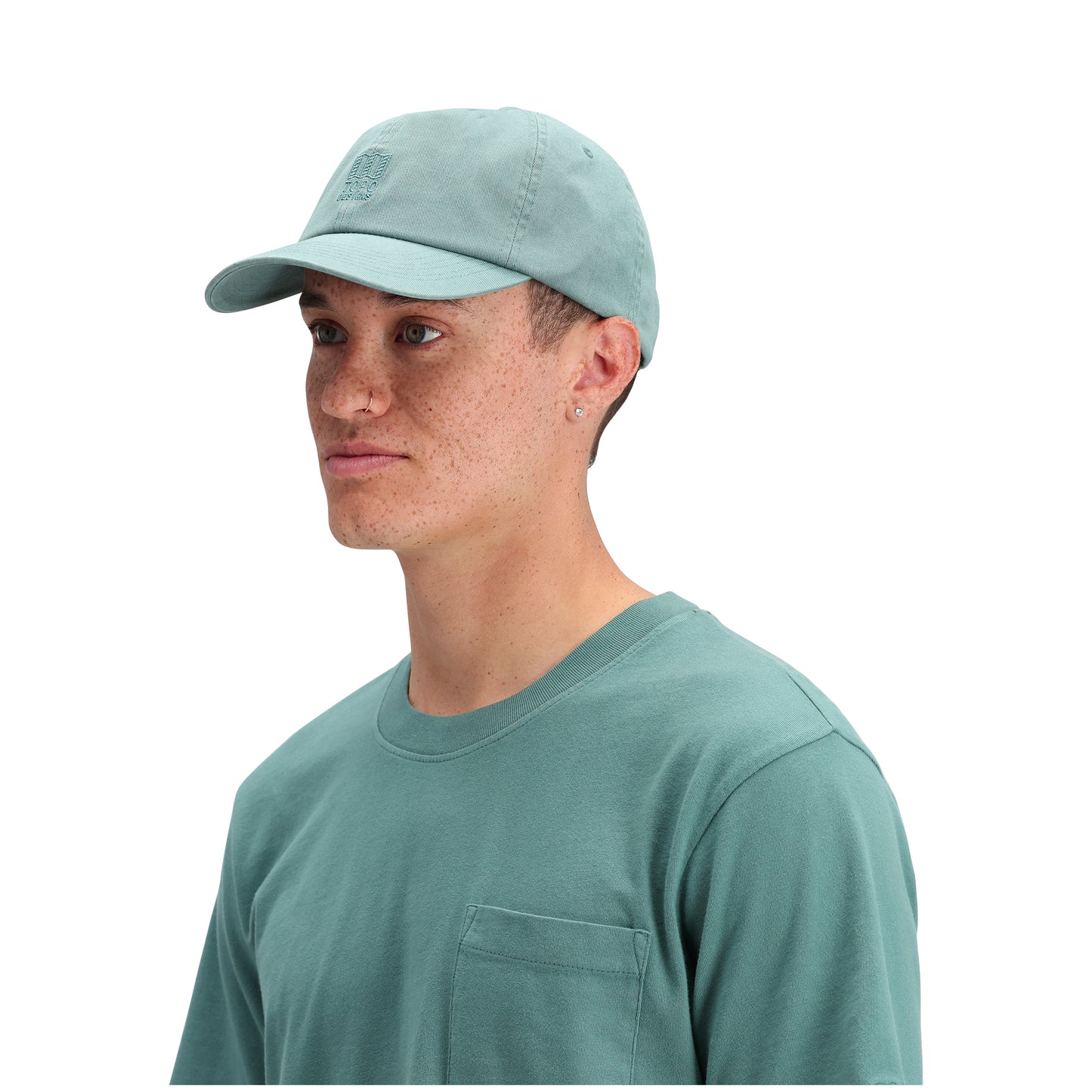 General side model shot of Topo Designs Dirt Ballcap in "Sea Pine"