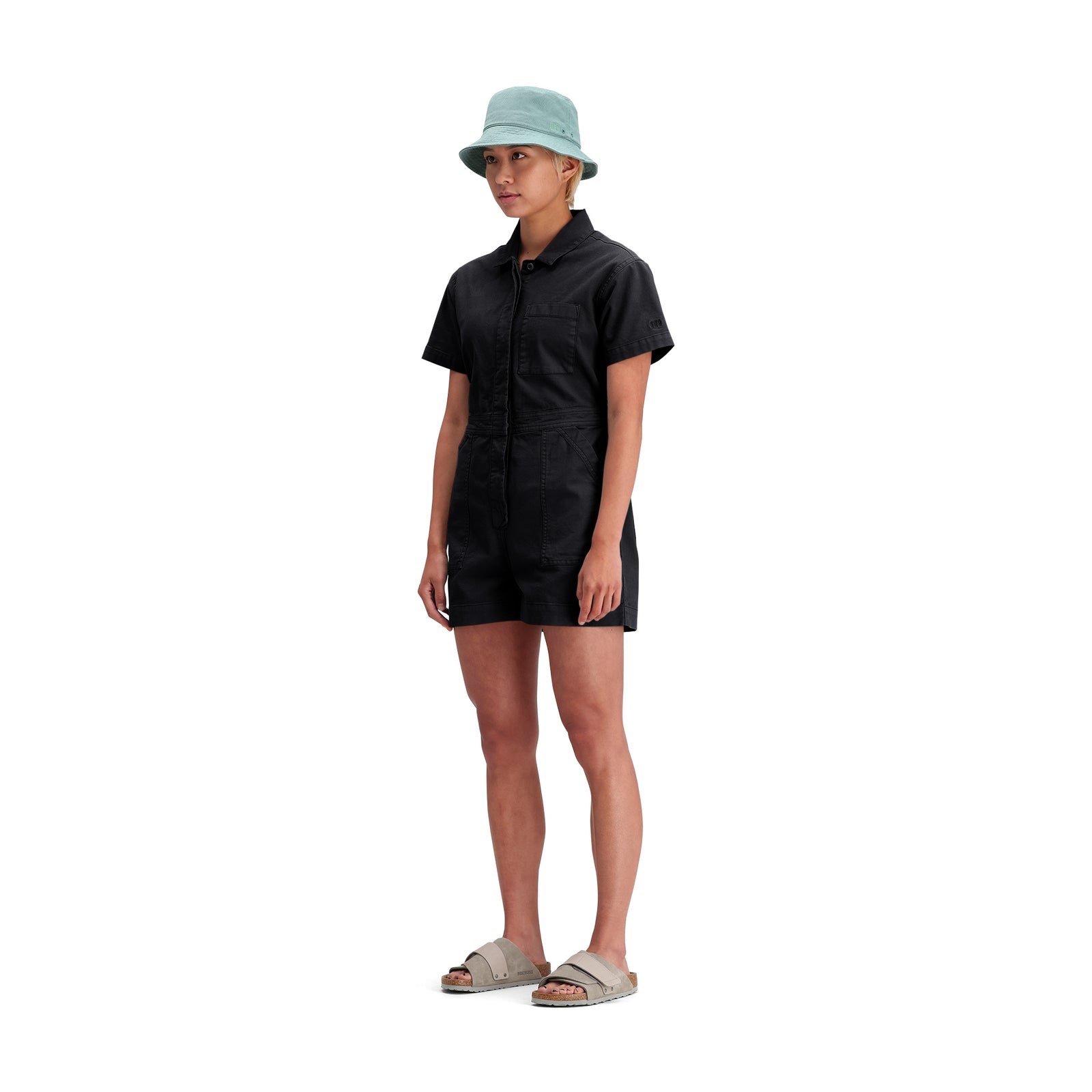 General side model shot of Topo Designs Dirt Romper - Women's in "Black"