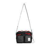 Front view of Topo Designs Block Bag in "Black / White Grid"