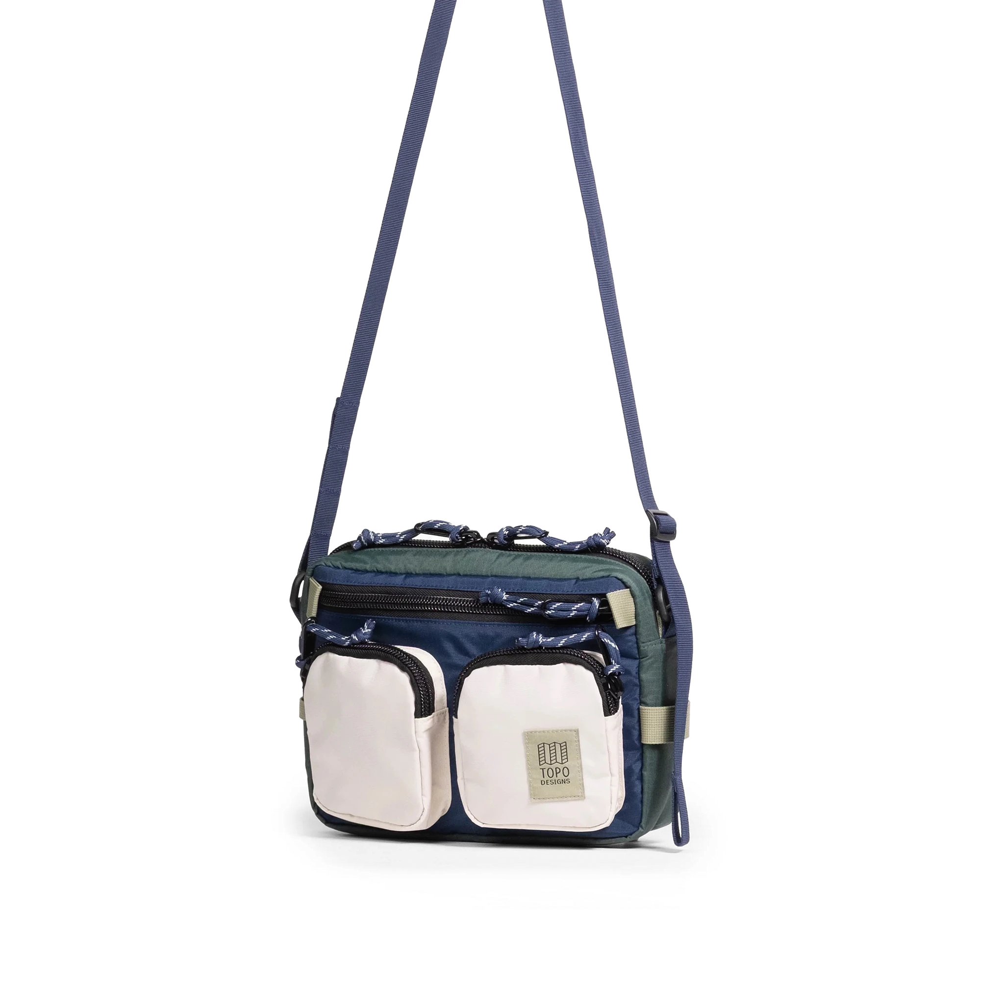 Front quarter view of Topo Designs Block Bag in "Forest / Bone White"