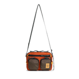 Front view of Topo Designs Block Bag in "Woodland / Terracotta"