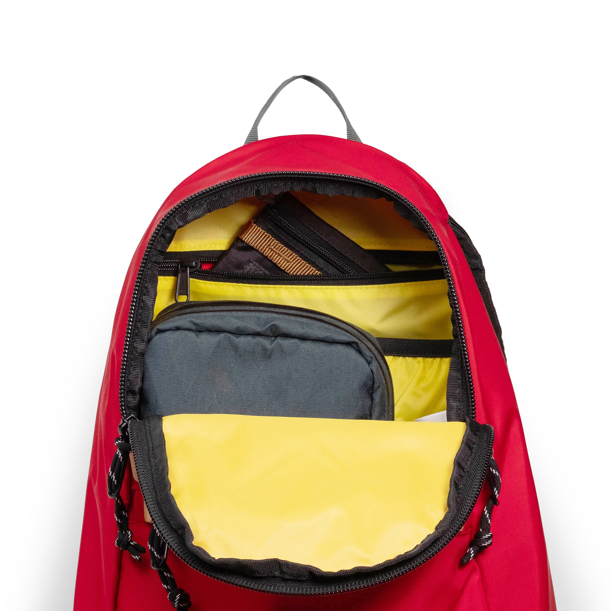 General detail view of Topo Designs Classic Teardrop Backpack in "Salsa" with the main compartment opened.