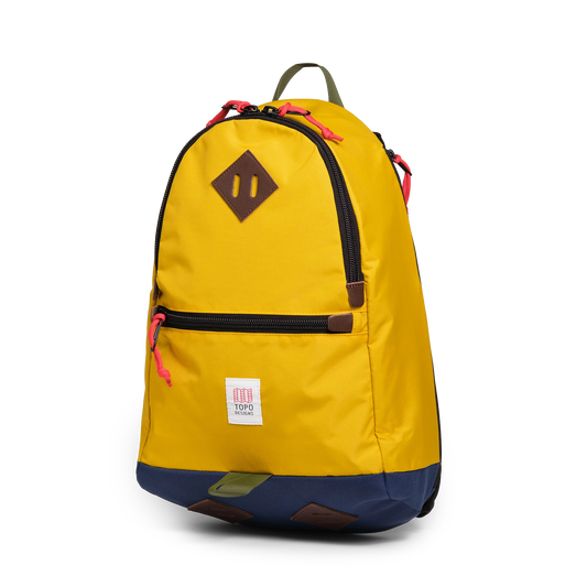 Quarter view of Topo Designs Classic Teardrop Backpack in "Sunset / Midnight"