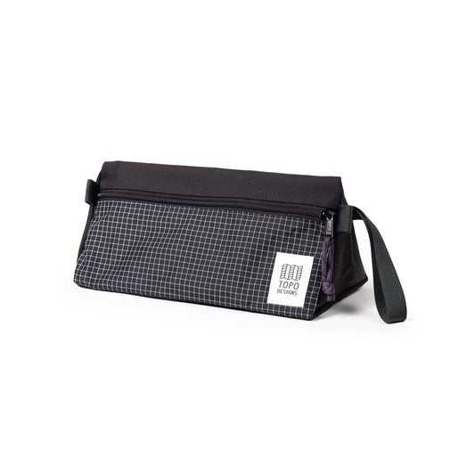 Quarter View of Topo Designs Dopp Kit in "Black / White Grid"