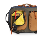 General full front product shot of the global briefcase showing use of the front zip pocket in "Olive / Dark Khaki".