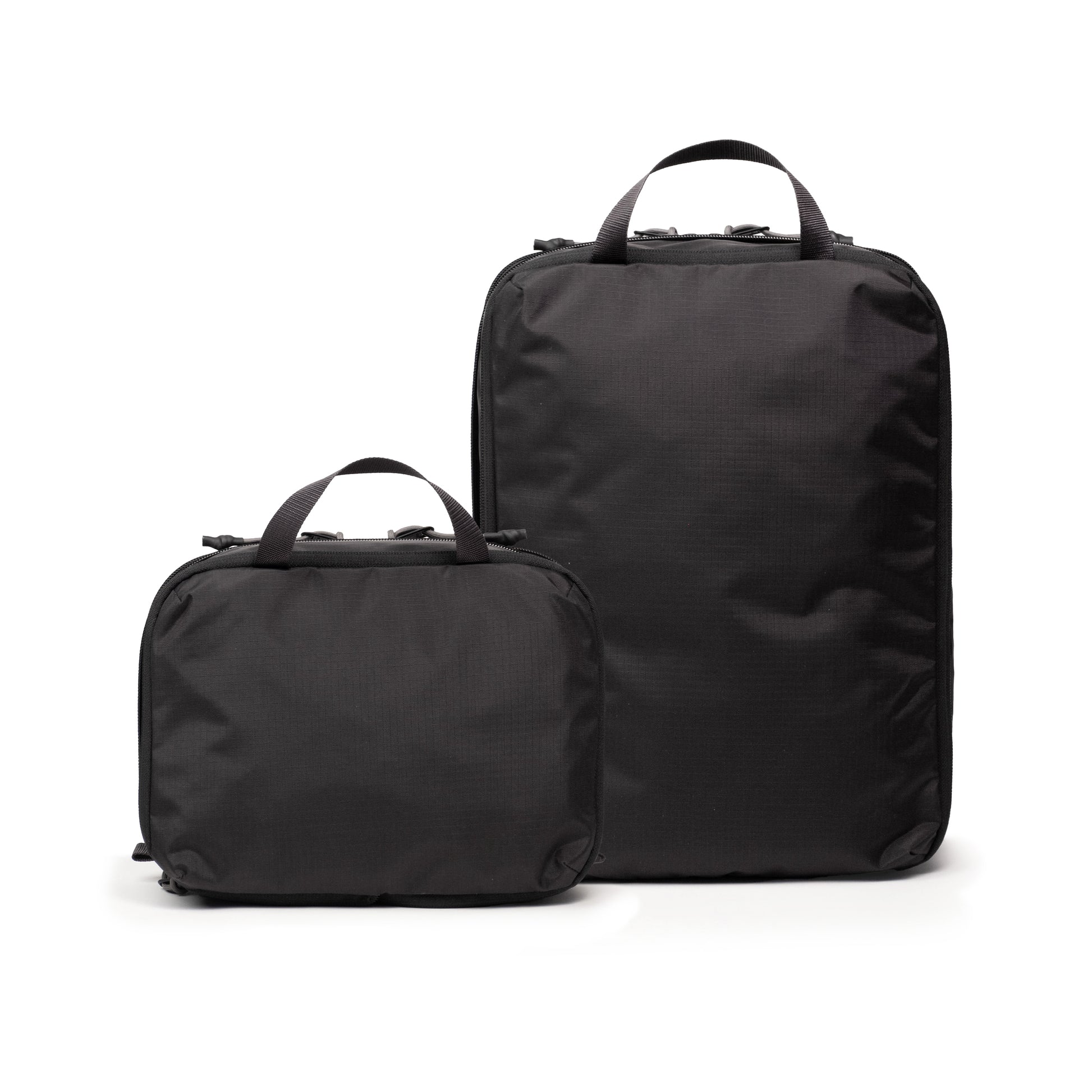 Back white background image of Topo Designs Global Compression Pack Bag Set in "Black / Black"