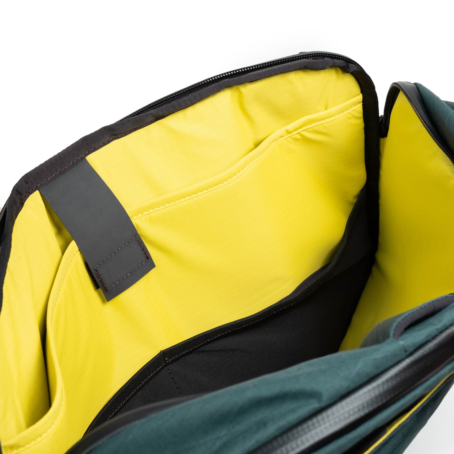 General shot of Topo Designs Global Pro 3-Way Briefcase showing interior laptop sleeve.