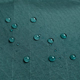 General shot of Topo Designs Global Pro Tech Case water droplets on waterproof material