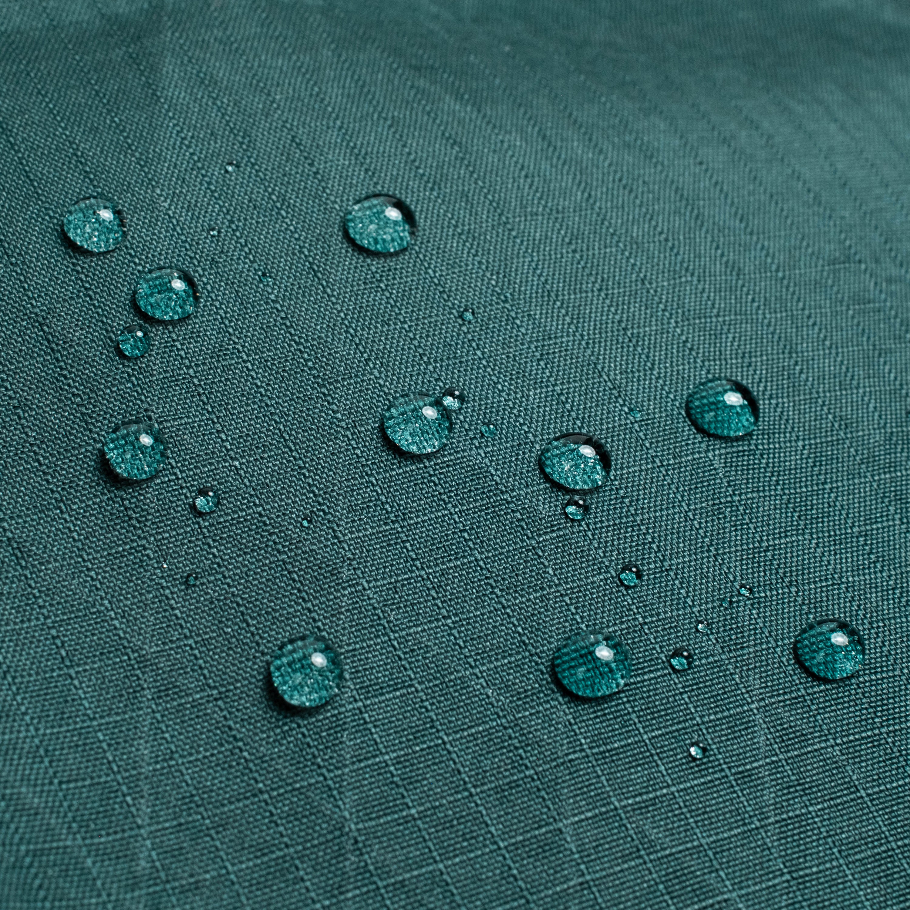 General shot of Topo Designs Global Pro Tech Case water droplets on waterproof material