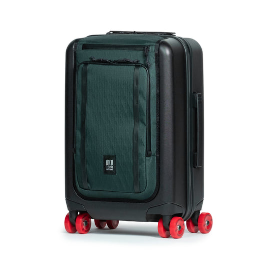 Front quarter shot of Topo Designs Global Pro Travel Roller Bag in "Dark Pine"
