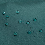 General back shot of Topo Designs Global Pro Travel Roller Bag showing water droplets on waterpoof material